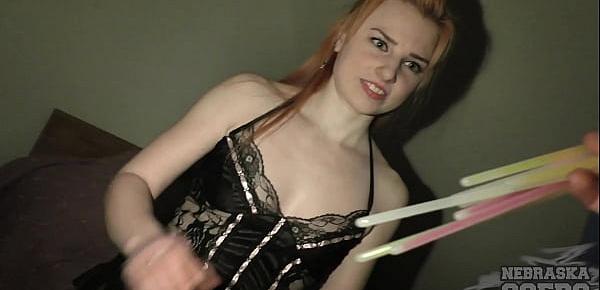  small ginger hottie opening up her pussy with glowsticks for masturbation fun